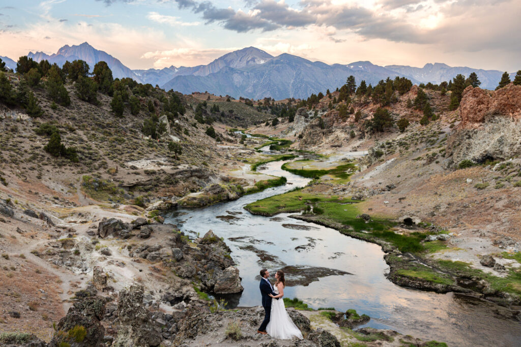 Couple walking through a Mammoth Lakes elopement location at golden hour