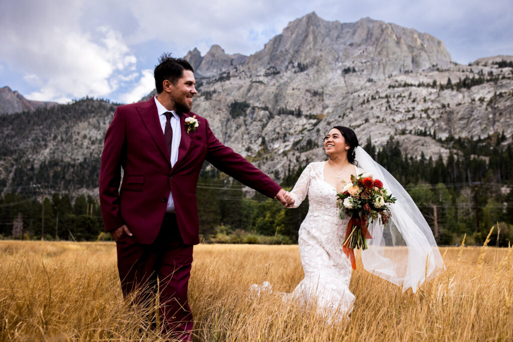 Mammoth Lakes elopement couple walking below Eastern Sierra mountains