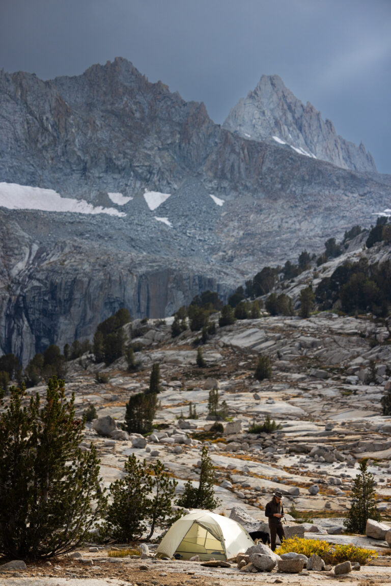 Jagged granite peaks beneath dark storm clouds