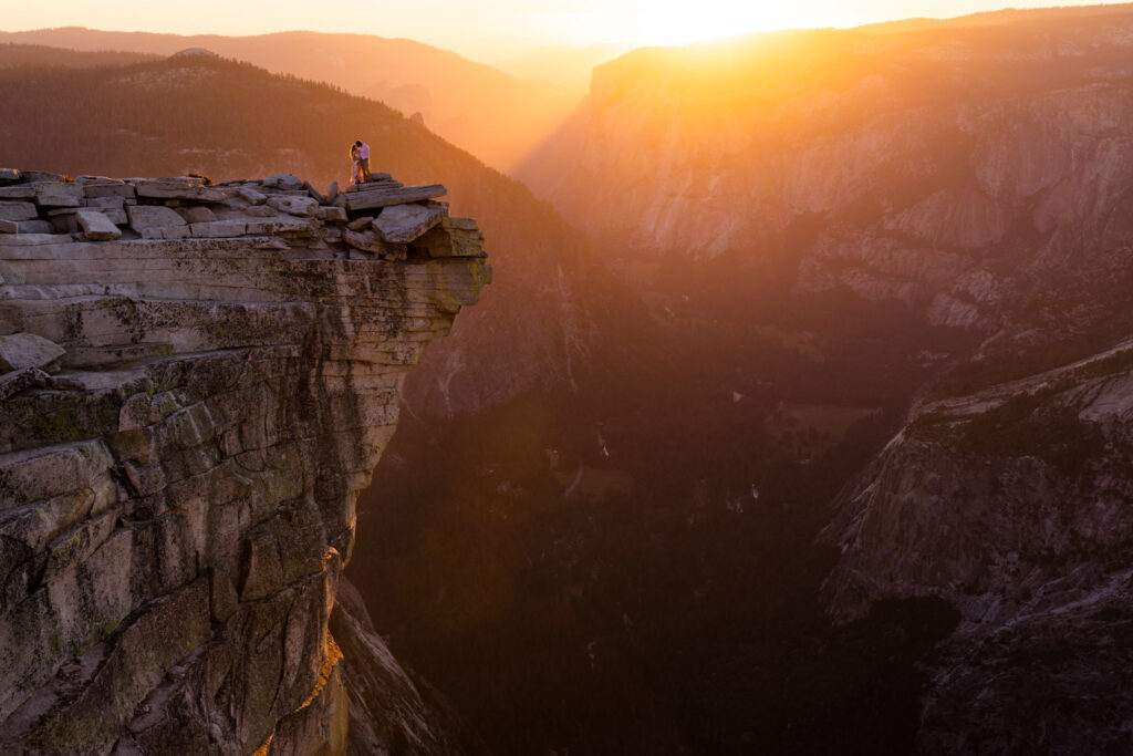 Sunset illuminating a granite cliff above a deep valley